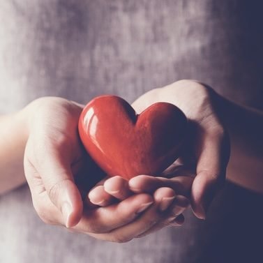 Asian woman holding red heart, health insurance, donation charity concept